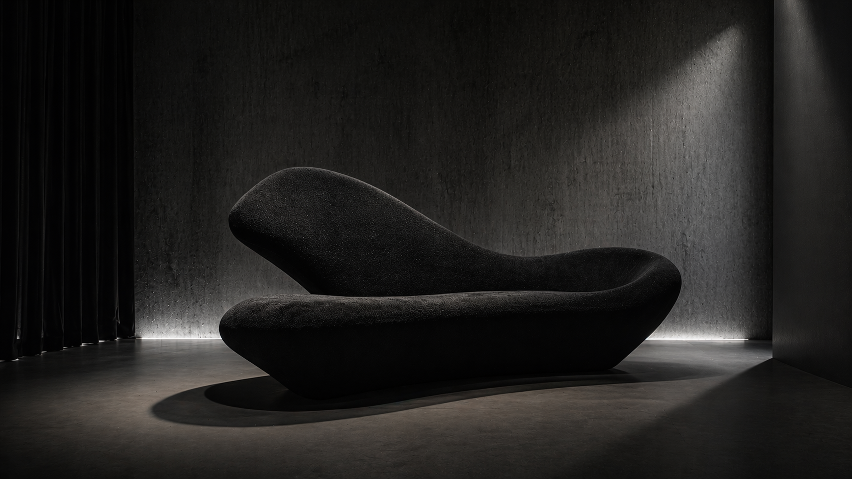 UMBRA sculptural sofa in a dark gallery under directional light.