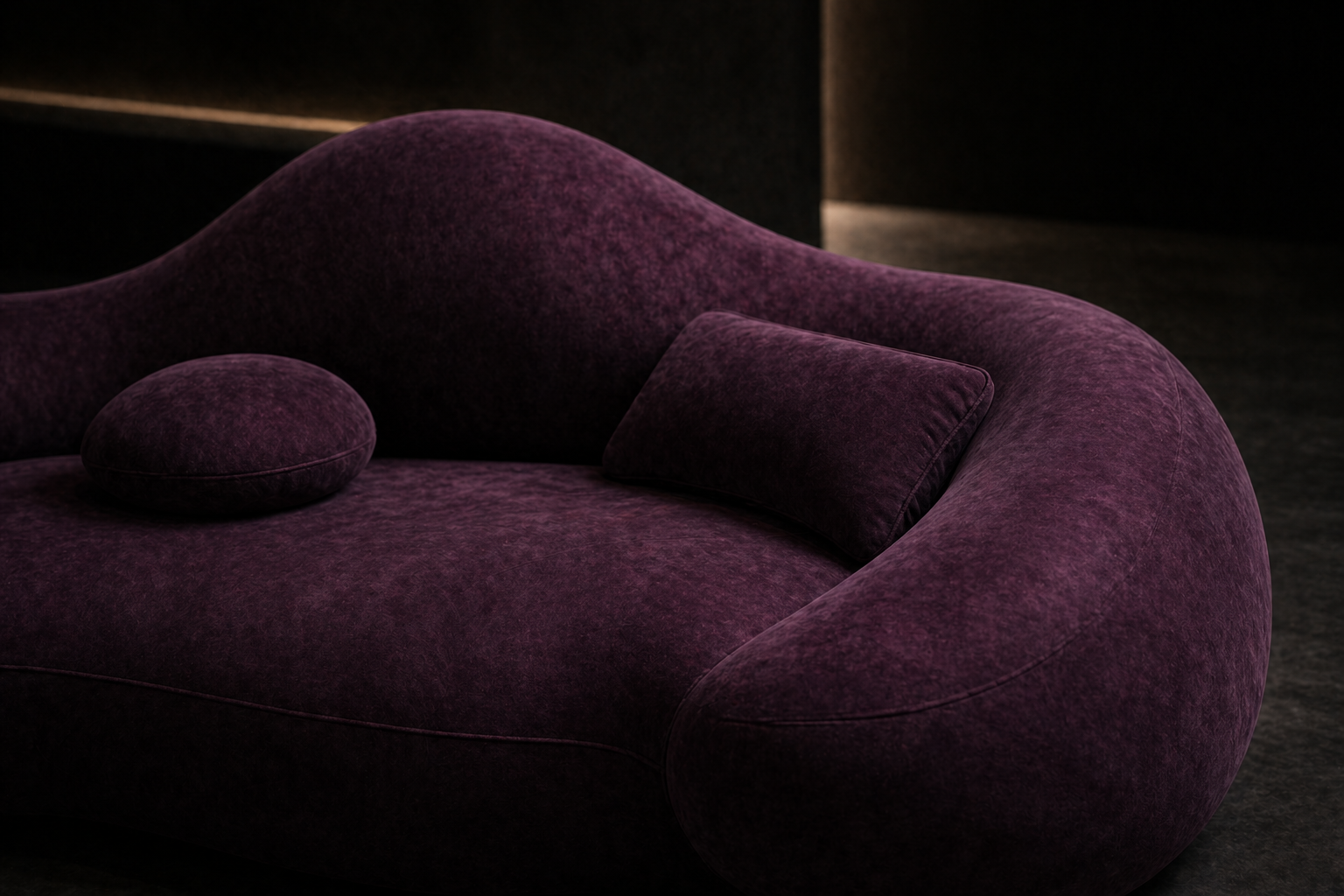 Close detail of NOX curved upholstery and pillows.